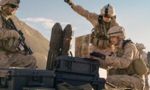 Soldiers are Using Laptop Computer for Surveillance During Military Operation in the Desert.